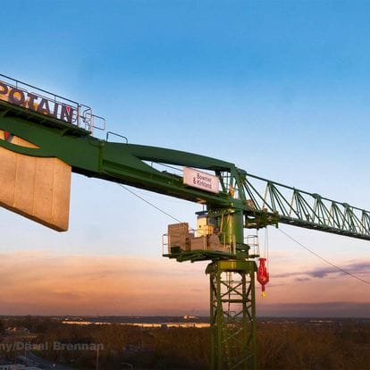 Aerial Photograph Green Lifting Crane Sunset
